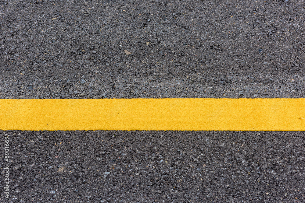 Fototapeta premium yellow line on the road texture
