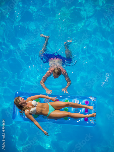 Couple Outside Relaxing In Swimming Pool © Netfalls