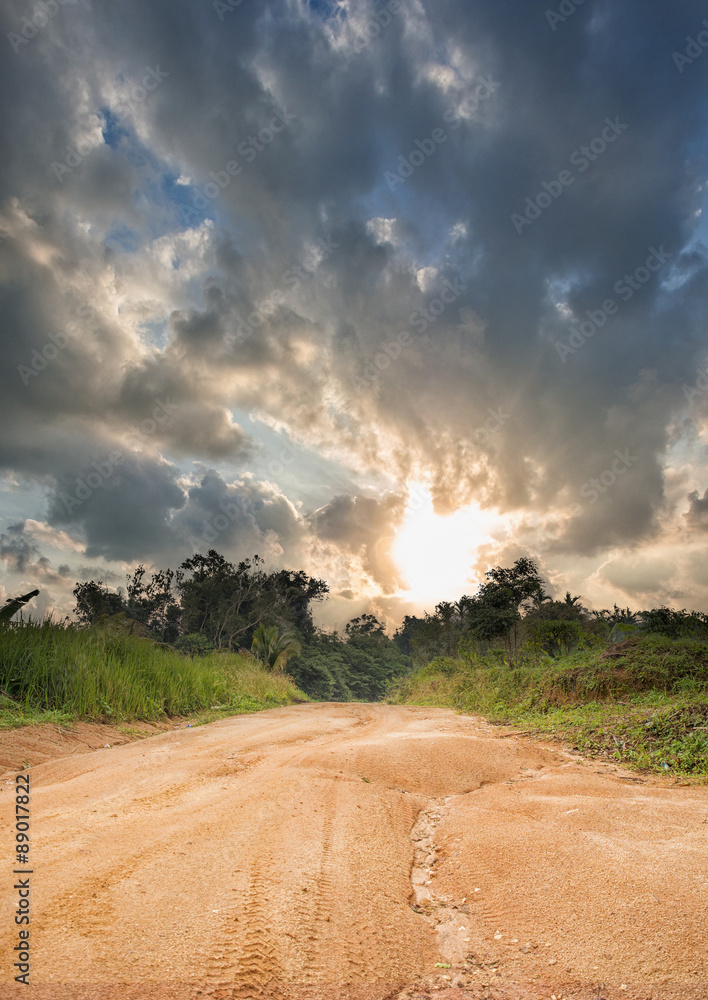 Dirt road in the jungle in Thailand