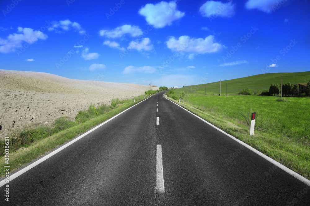Country ashpalt road in Tuscany, Italy. Country ashpalt road in Tuscany, Italy.