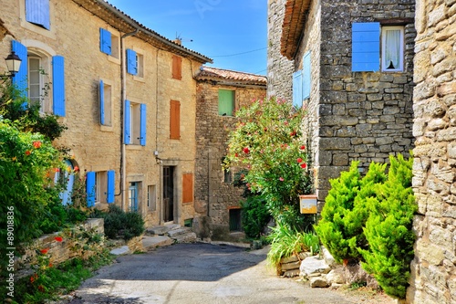 Fototapeta Naklejka Na Ścianę i Meble -  Pretty houses with colorful shuttered windows in a quaint village in Provence, France