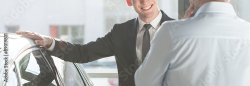Smiling man by the car