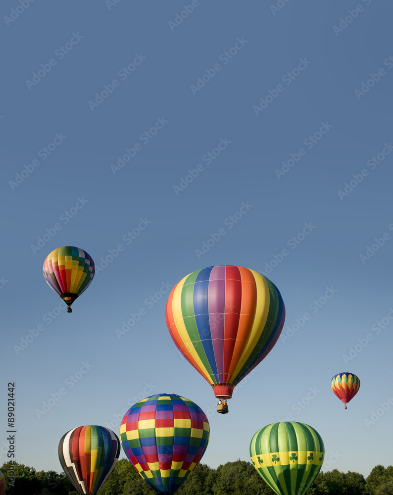 Hot-air balloons ascending or launching at a ballooning festival Hot-air balloons ascending or launching at a ballooning festival