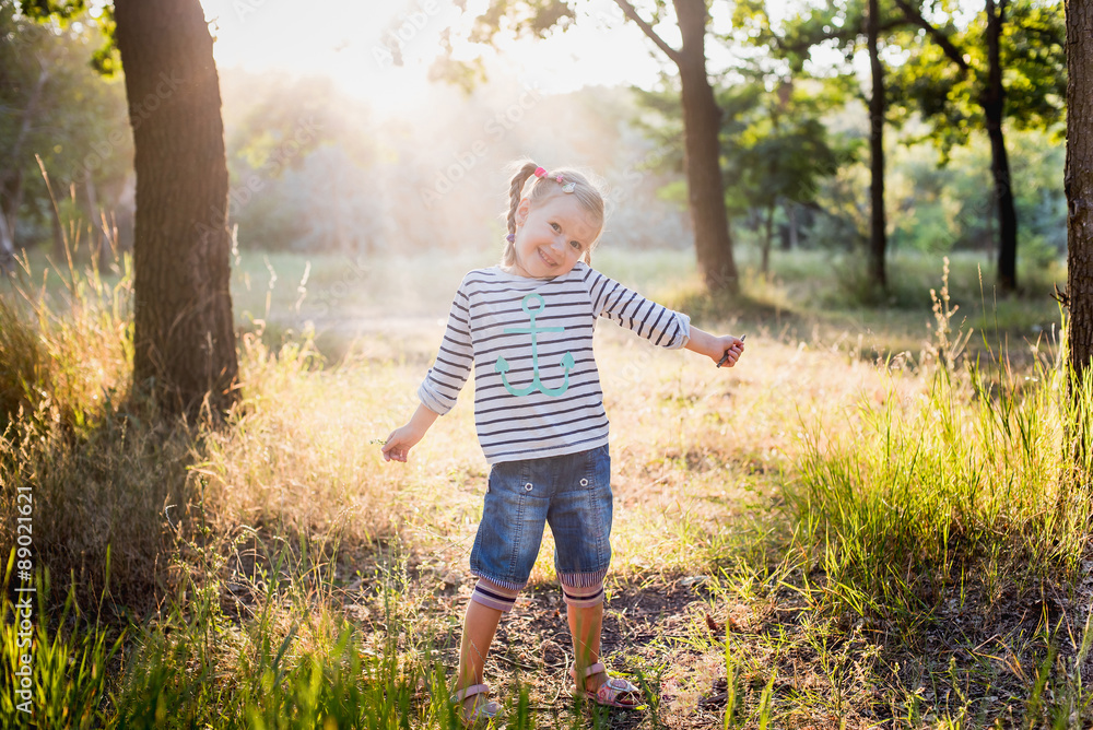 little girl playing in the park in summer day little girl playing in the park in summer day