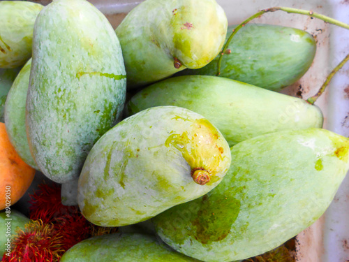 Green mangoes.
