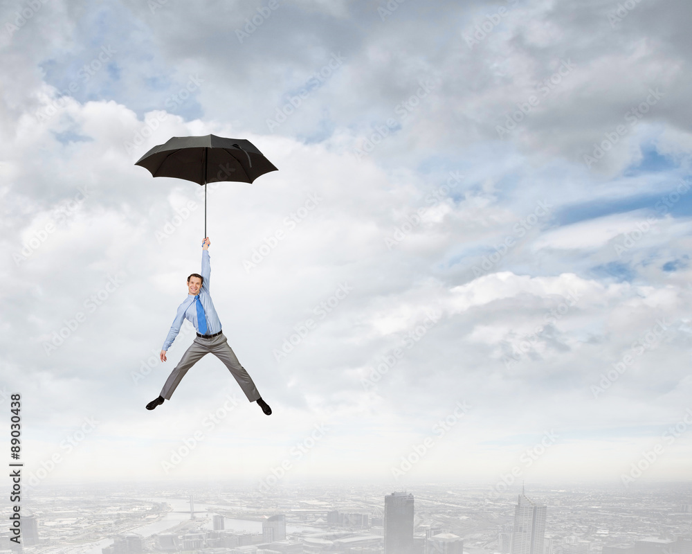 Man fly on umbrella
