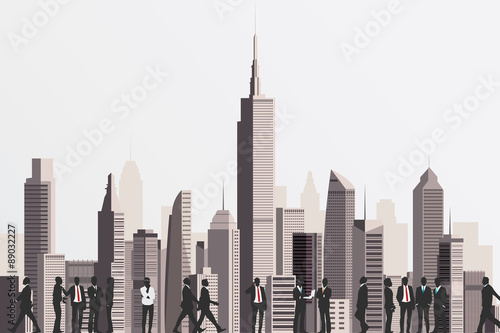 Silhouettes of business people with skyscraper building on backd
