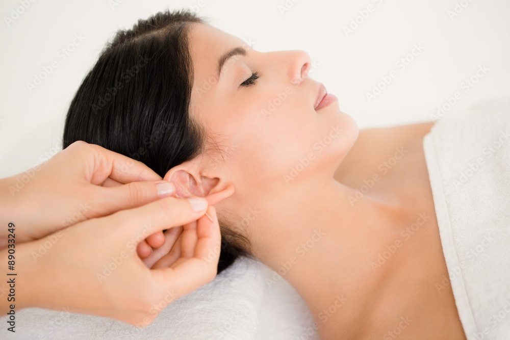 Woman in an acupuncture therapy