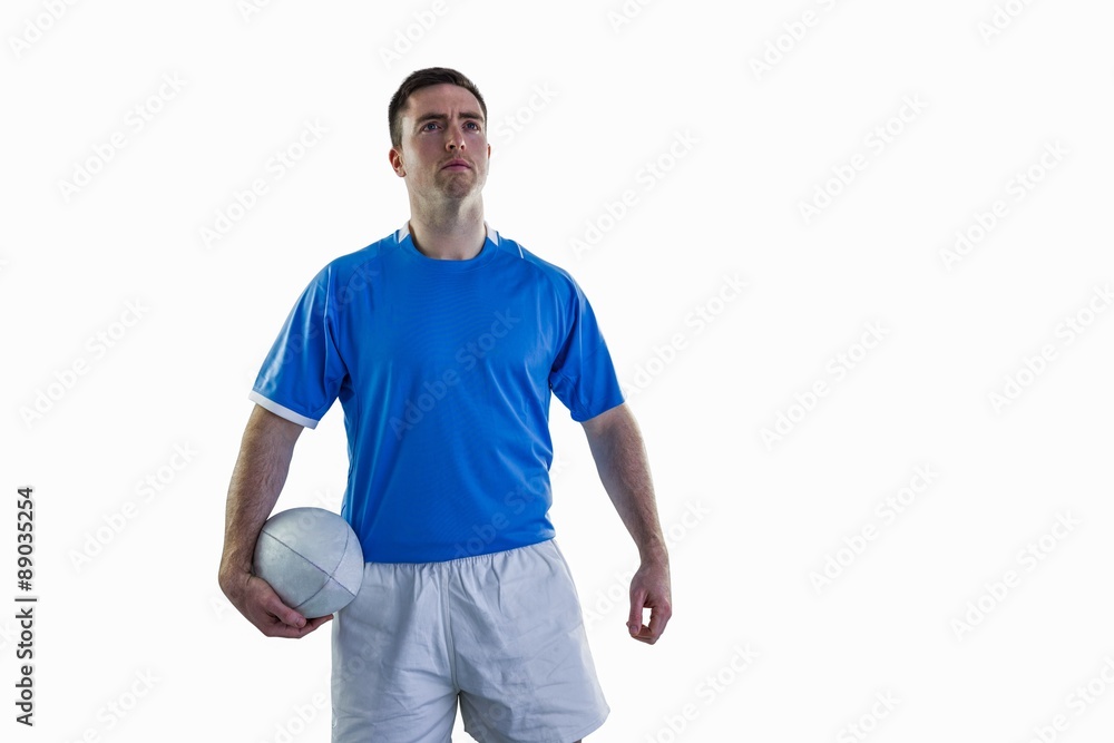Rugby player holding a rugby ball Rugby player holding a rugby ball