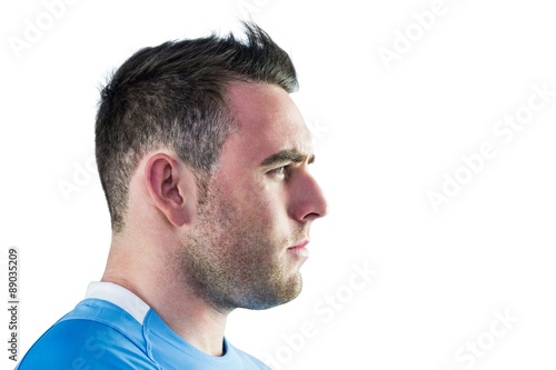Tough rugby player looking away