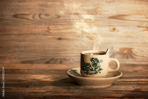 Canvas Print Steaming traditional Chinese coffee in vintage mug and saucer