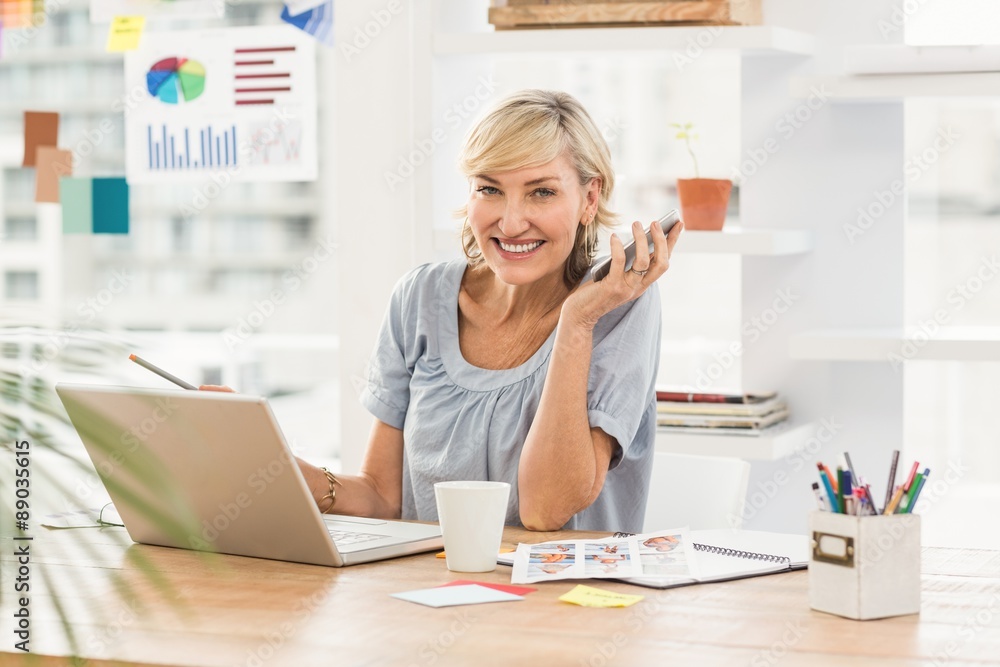 Smiling businesswoman looking at the camera Smiling businesswoman looking at the camera