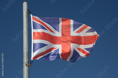 England UK Wavy Flag undre blue sky photo