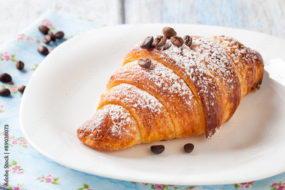 Croissant with coffee beans Croissant with coffee beans