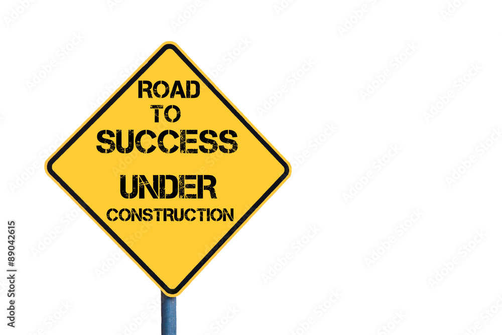 Yellow roadsign with Road To Success Under Construction message Yellow roadsign with Road To Success Under Construction message