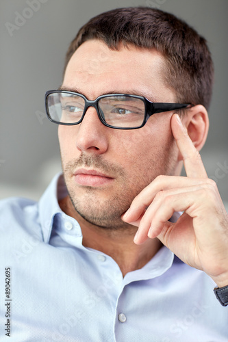 portrait of  businessman in eyeglasses at office © Syda Productions