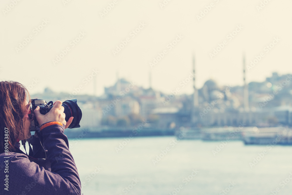 Female tourist taking photos in Istanbul Turkey
