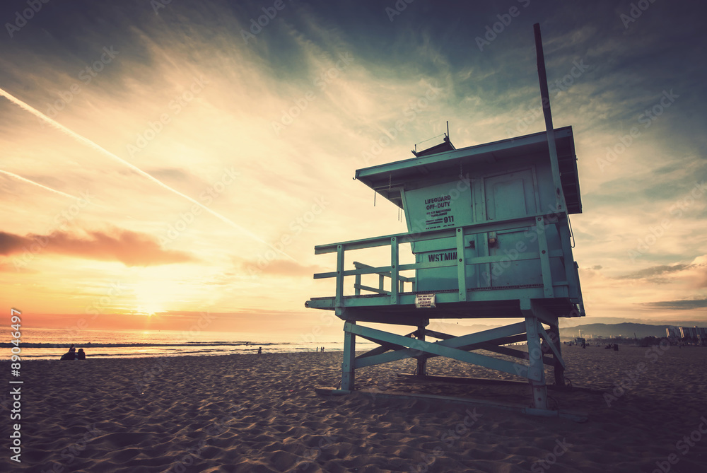Naklejka premium Venice beach, sunset. Lifeguard stand. Vacation, summer, travel, nature and life style concept. Vintage colors post processed.