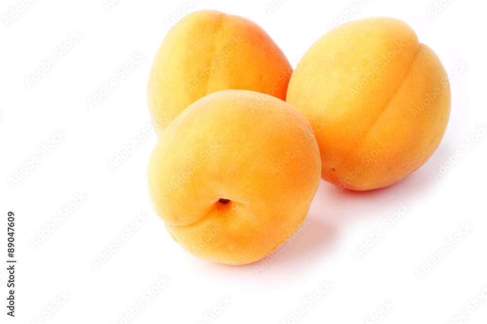 Three apricots isolated on a white background farm organic product Three apricots isolated on a white background farm organic product