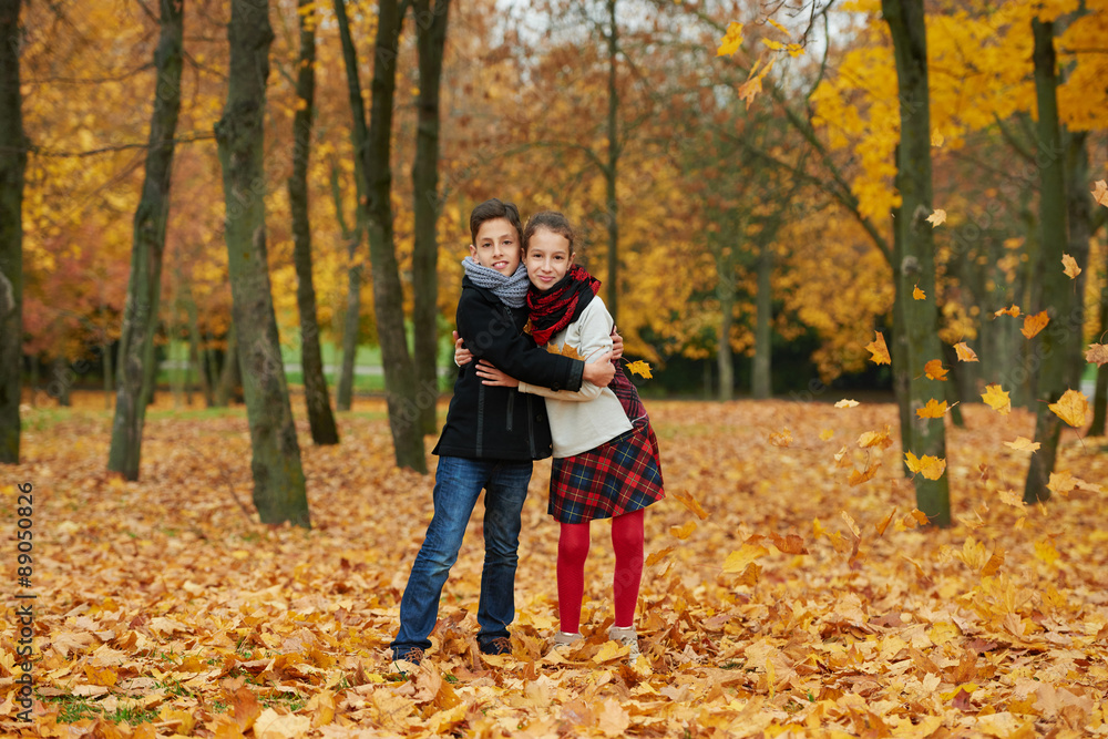 Fototapeta premium boy and girl in autumn park