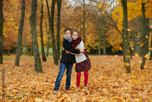 boy and girl in autumn park