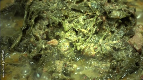 Curry leaves of cassia with coconut milk and pork photo