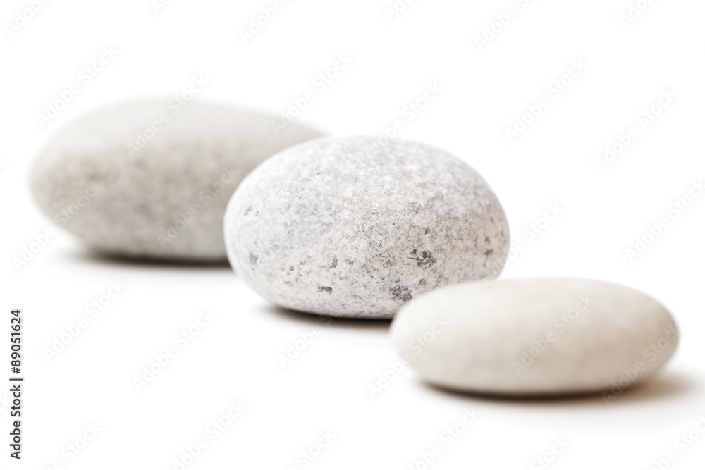 three gray spa stones isolated on white background three gray spa stones isolated on white background