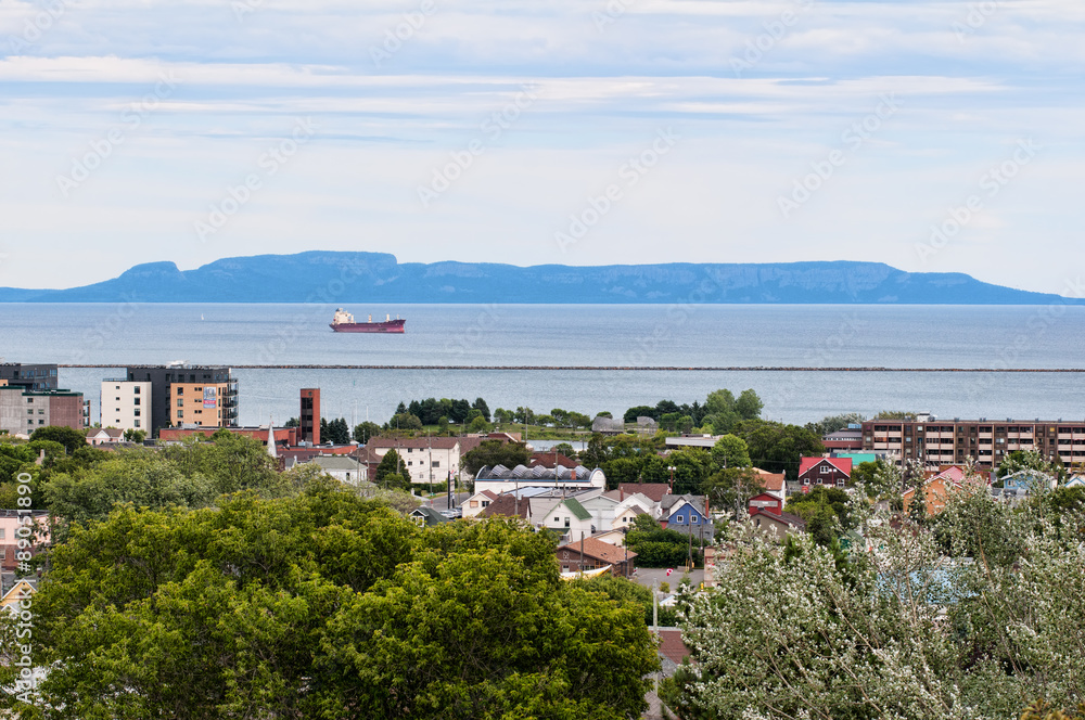 View of downtown Thunber Bay Ontario, Canada north ward and harbor from Hillcrest Park, with Sleeping Giant in background