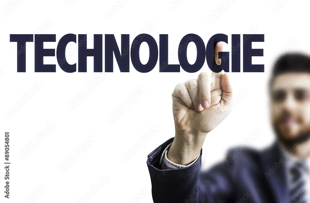 Business man pointing the text: Technology (in French) Business man pointing the text: Technology (in French)