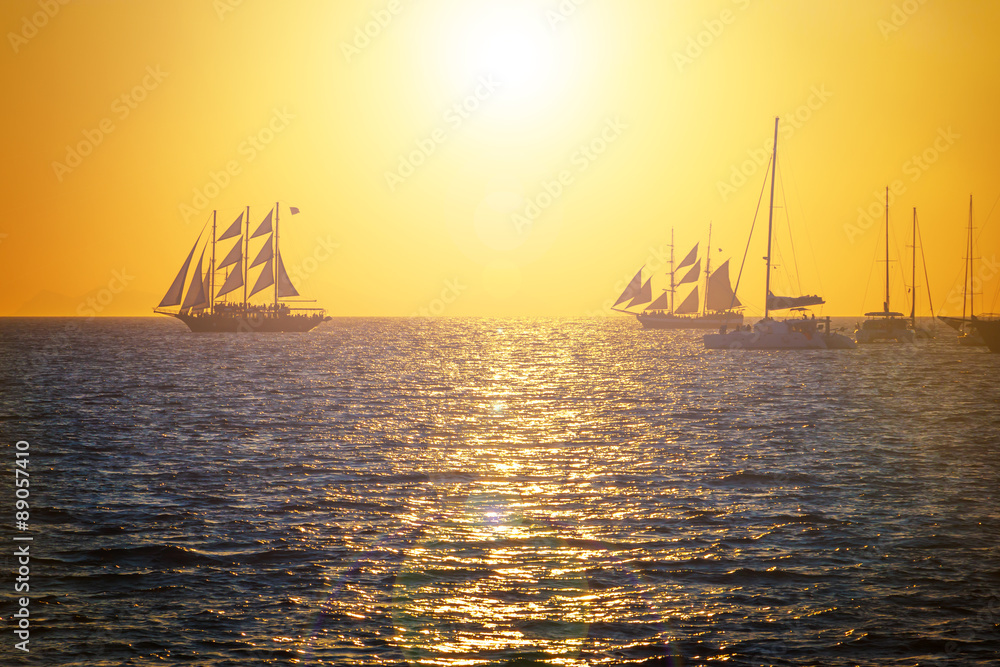 Sailing ships on the sea in sunset