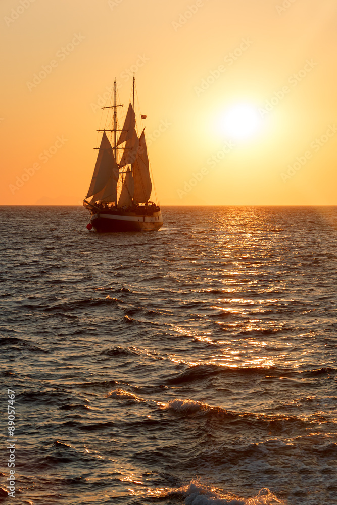 Sailing ship silhouette in sunset on the sea