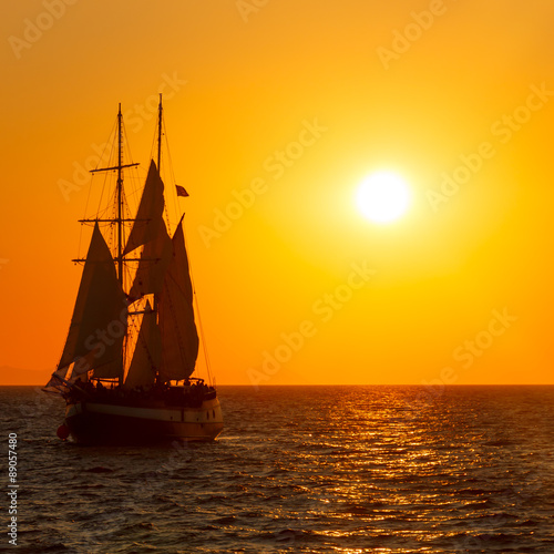 Sailing ship silhouette in sunset on the sea