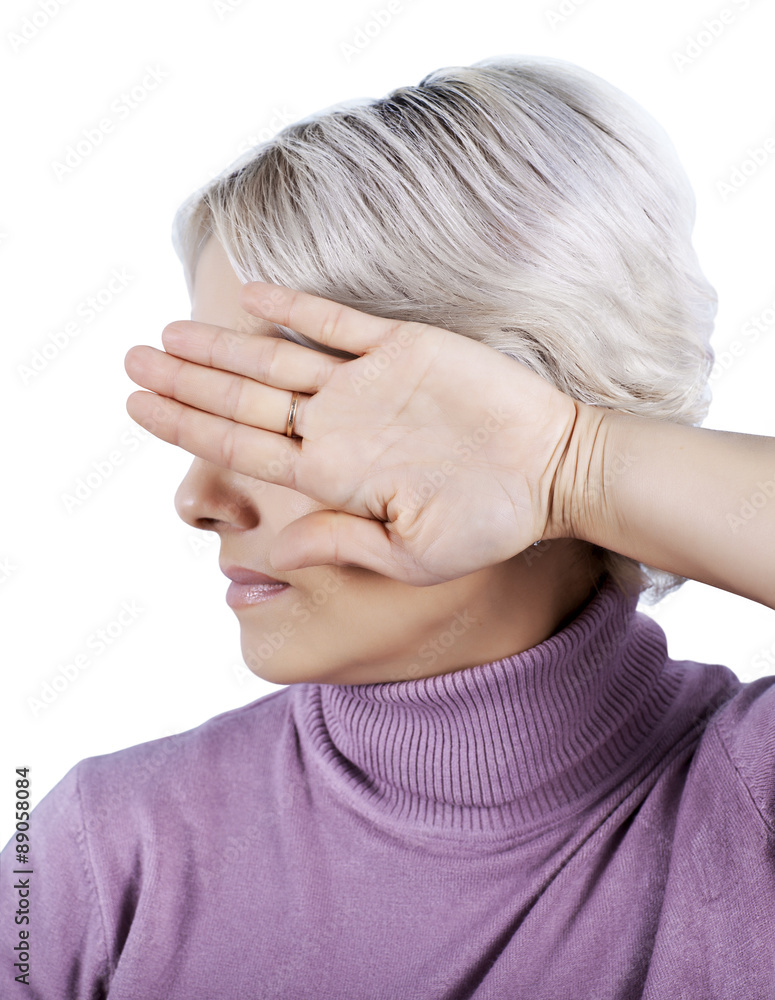 Fototapeta premium I'm not looking. The woman closes her eyes turning away hand