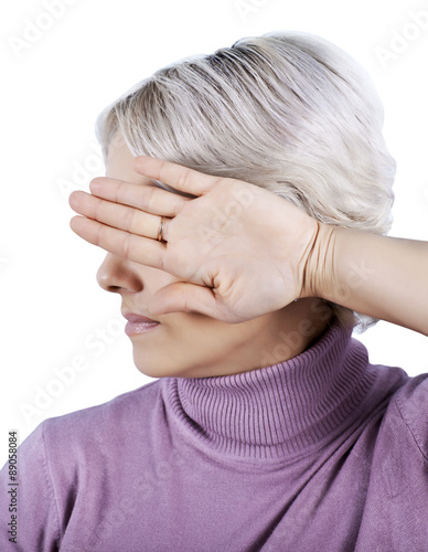 Fotografia I'm not looking. The woman closes her eyes turning away hand