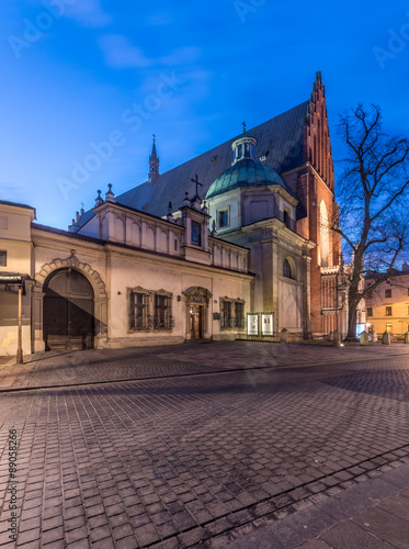 Krakow, Poland, main gate to the dominican monastery and gothic church of Holy Trinity, seen from Stolarska street in the morning. #89058266