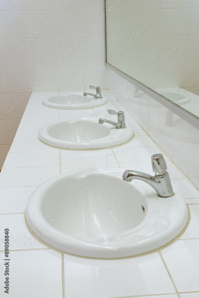 Bathroom at office.Handbasin and mirror in toilet Bathroom at office.Handbasin and mirror in toilet