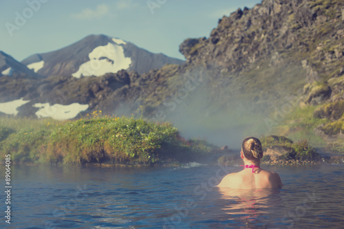 Young woman relax in a hot spring in Iceland Landmannalaugar © lkoimages