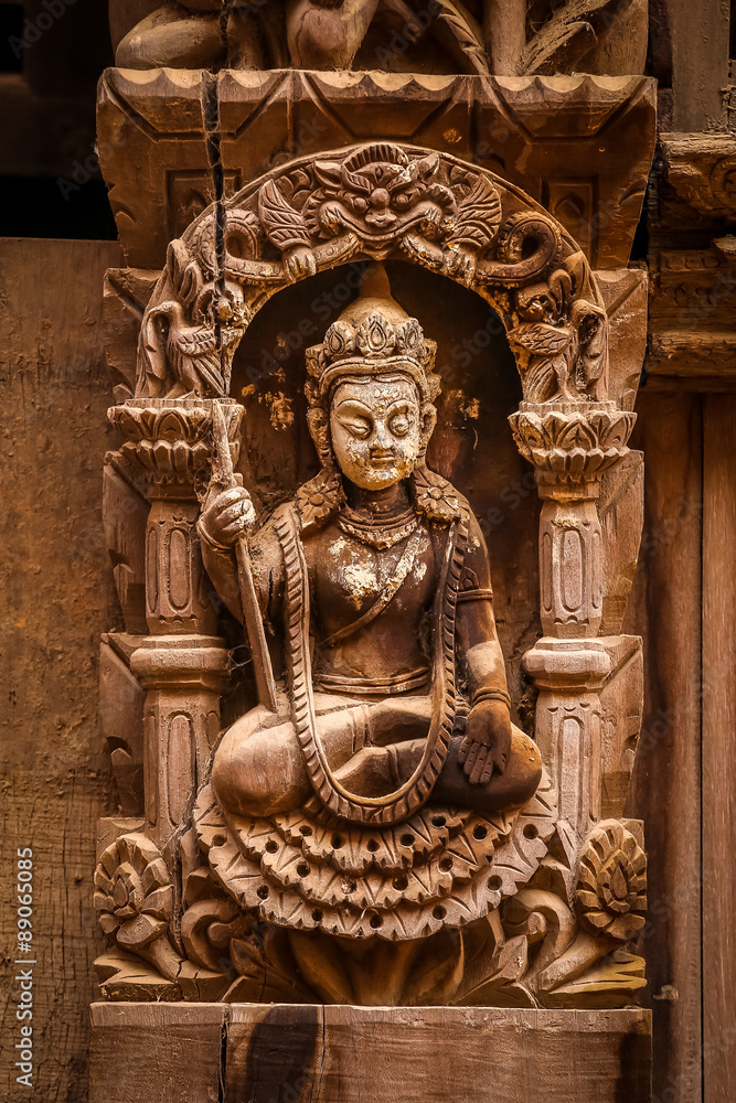 Fototapeta premium Wooden nepalese statue