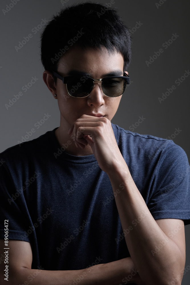 Asian man portrait with retro sunglasses Asian man portrait with retro sunglasses
