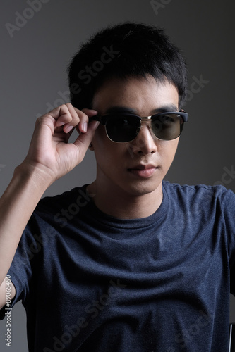 Asian man portrait with retro sunglasses © crazybboy
