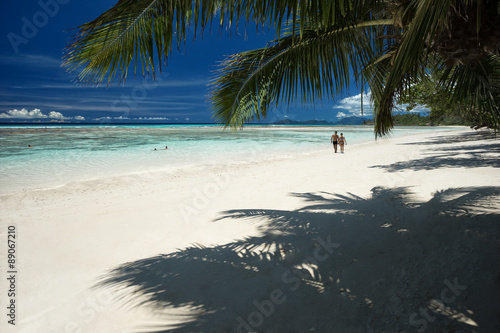 Summer beach with clouds  blue sky and palm tree  beautiful paradise for holiday and relax 