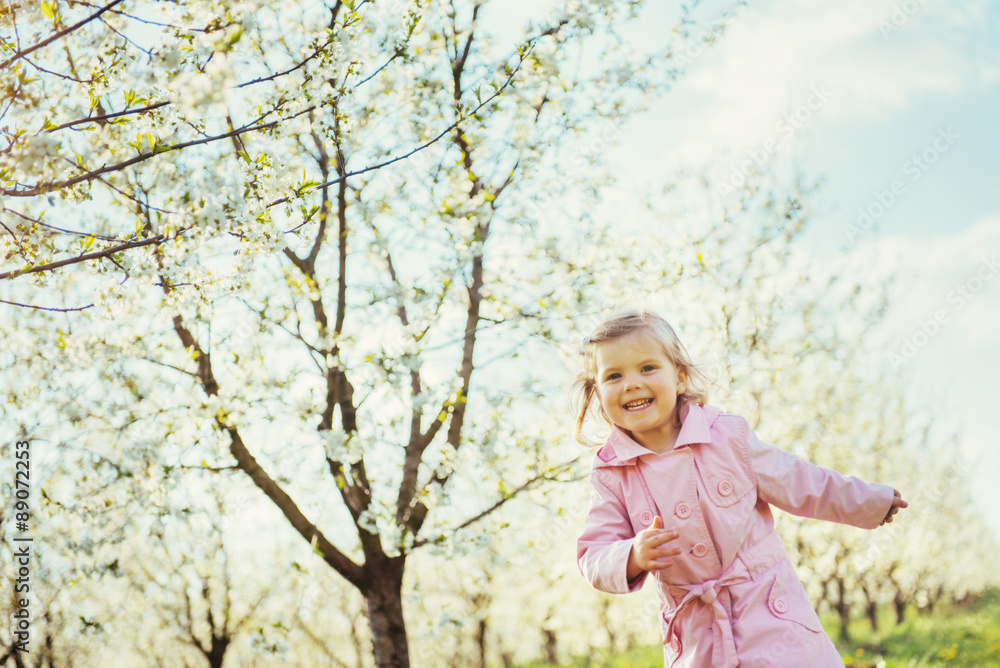 child running outdoors blossom trees. Art processing and retouch child running outdoors blossom trees. Art processing and retouch