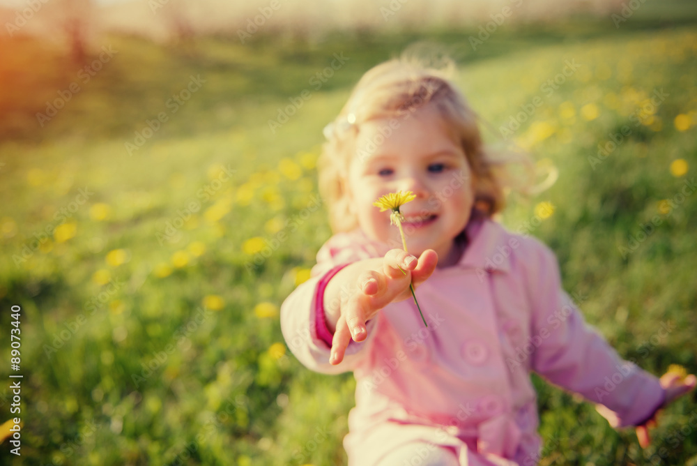 A child playing on a sunny spring day. Colorful toning effect. A child playing on a sunny spring day. Colorful toning effect.