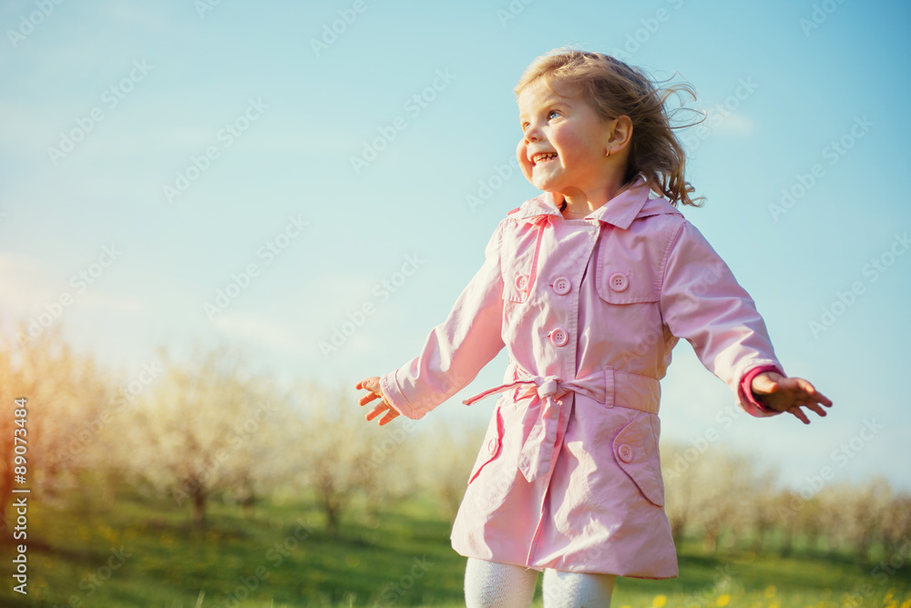 A child playing on a sunny spring day. Colorful toning effect. A child playing on a sunny spring day. Colorful toning effect.