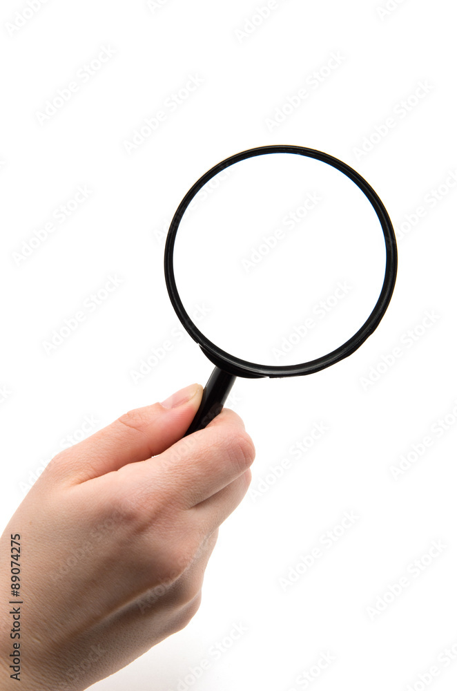 Hand holding magnifying glass isolated on white background Hand holding magnifying glass isolated on white background
