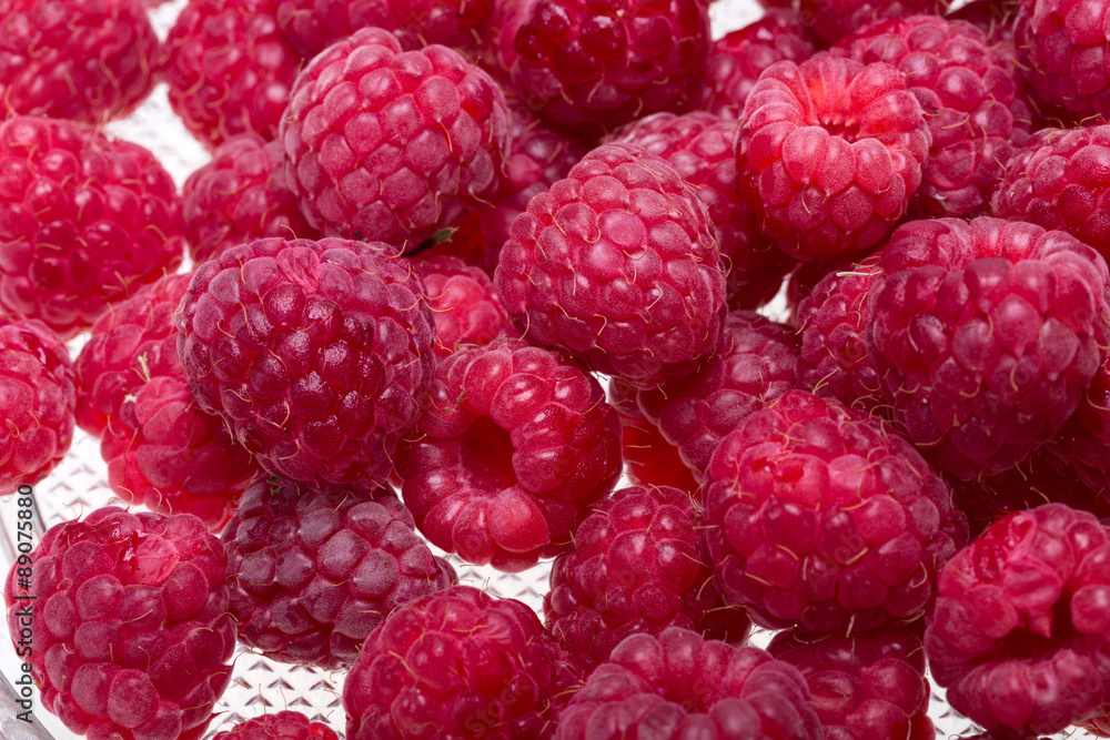 A beautiful selection of freshly picked ripe red raspberries. A beautiful selection of freshly picked ripe red raspberries.