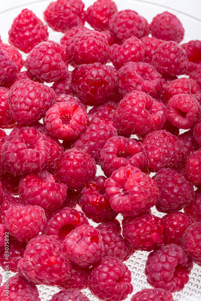 A beautiful selection of freshly picked ripe red raspberries. A beautiful selection of freshly picked ripe red raspberries.