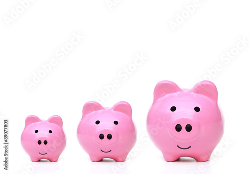 Three sizes of pink piggy bank for saving money