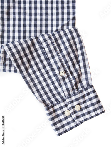 Black and white check shirt sleeve and button on white background