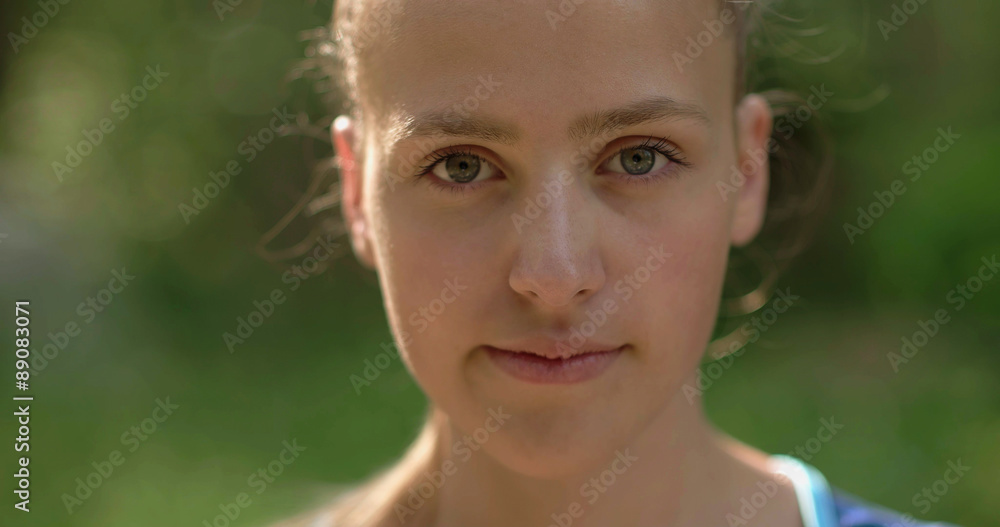 Girl placed in nature looking at the camera Girl placed in nature looking at the camera